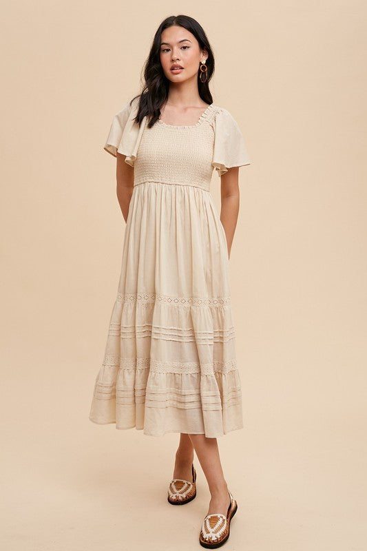 SMOCKED FLUTTER SLEEVE DRESS